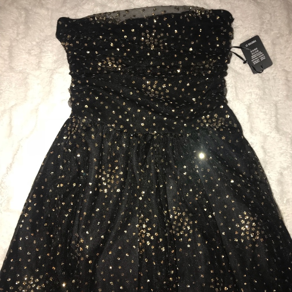 gold and black strapless sparkle dress